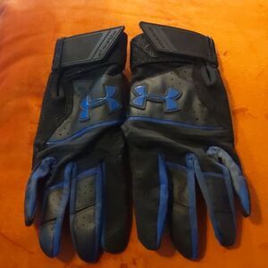 Under Armour batting gloves size YSM. Black and blue